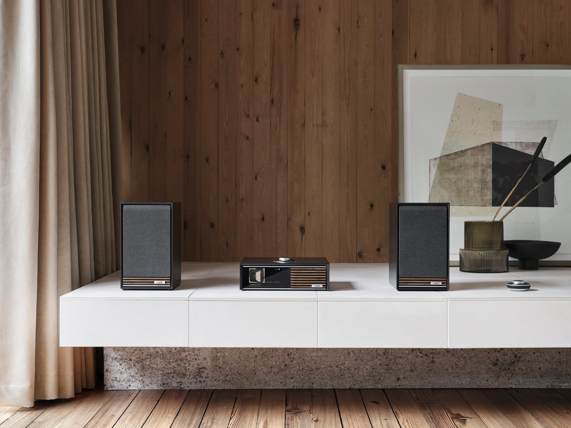 Ruark Audio stereo system with a wood wall in the background