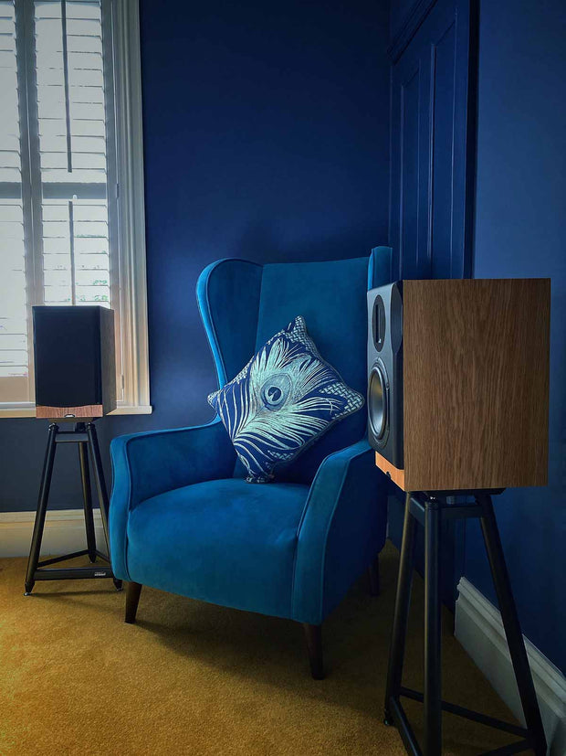 Neat Majistra speakers in a blue room