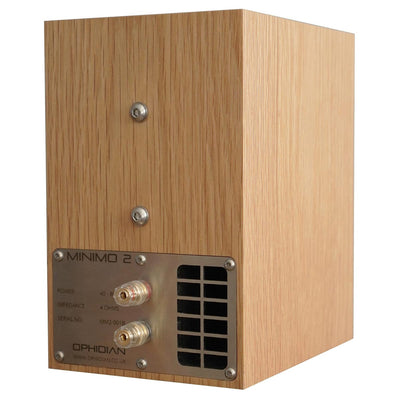 An Ophidian Minimo 2 bookshelf speaker with a wooden finish and a metal cover the over port and terminals.