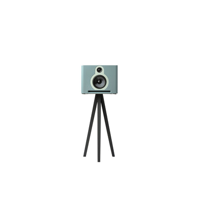 Guru Q10 bookshelf speaker in fog color, mounted on a matching Guru Standpoint black tripod stand against a solid white background.